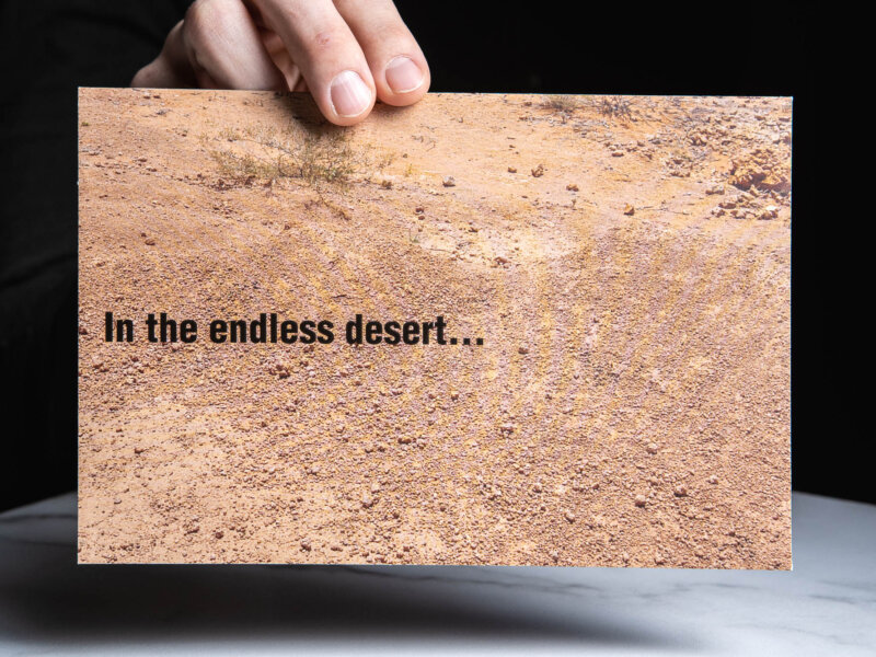 Envelope with desert saying "In the endless desert..."