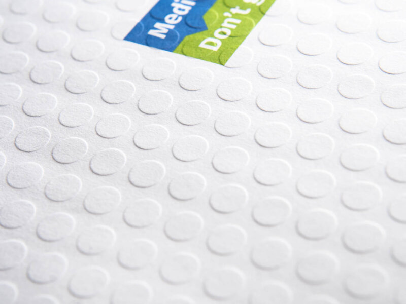 Up close detail of embossed dots on envelope