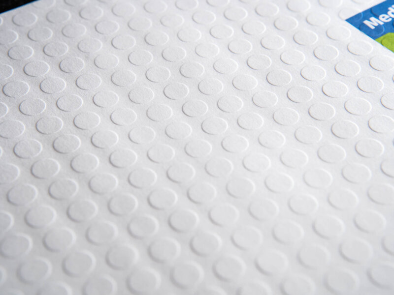 Up close detail of embossed dots on envelope
