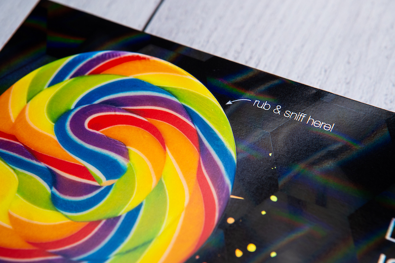 Cast and cure envelope of a rainbow lollipop with a rub and sniff element