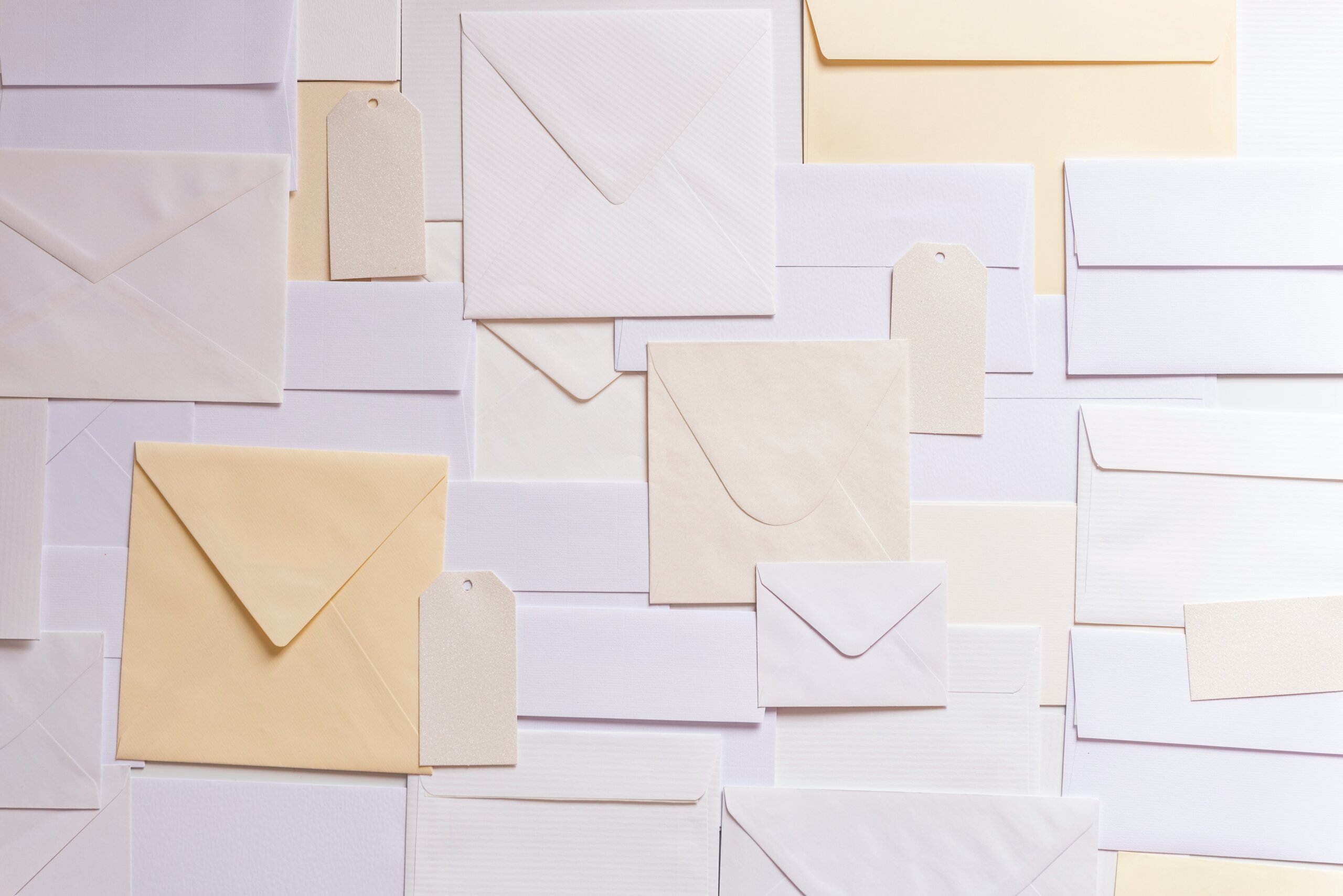 White and tan envelopes laid out on a table